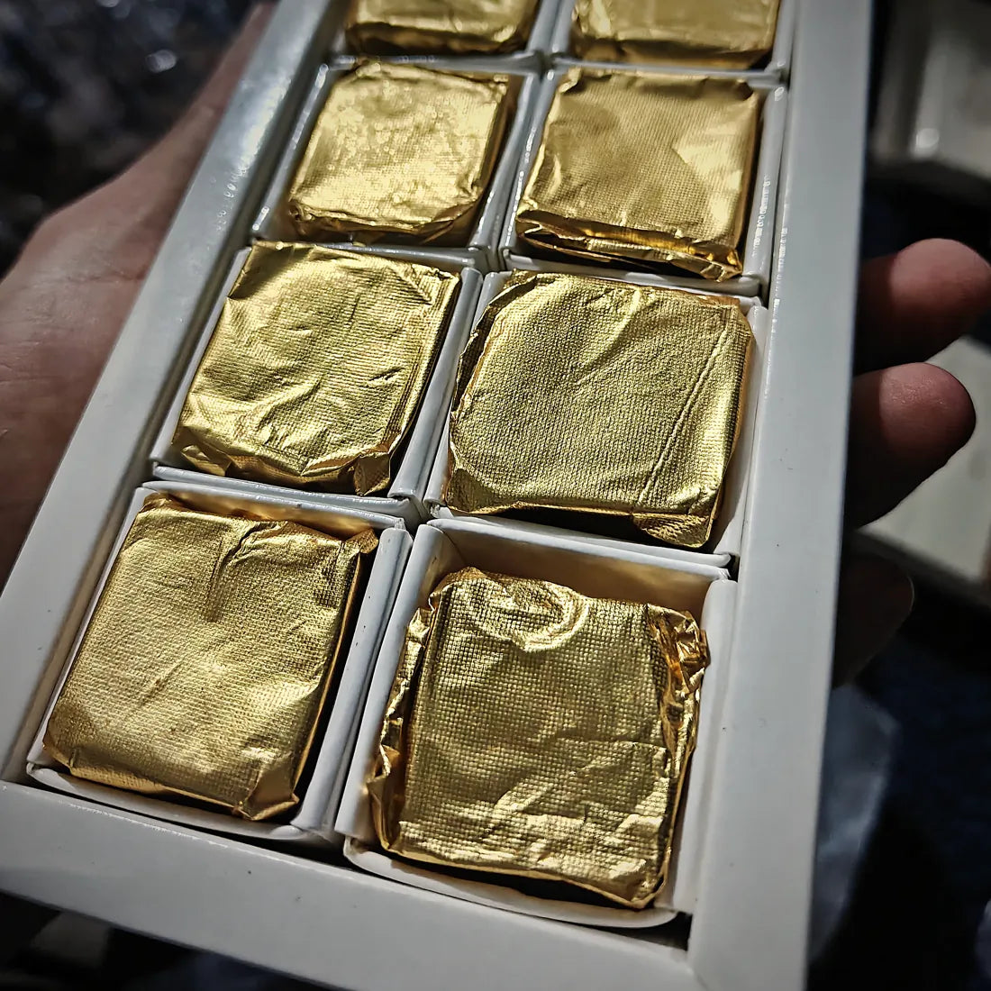 An open box of crownX chocolate cubes